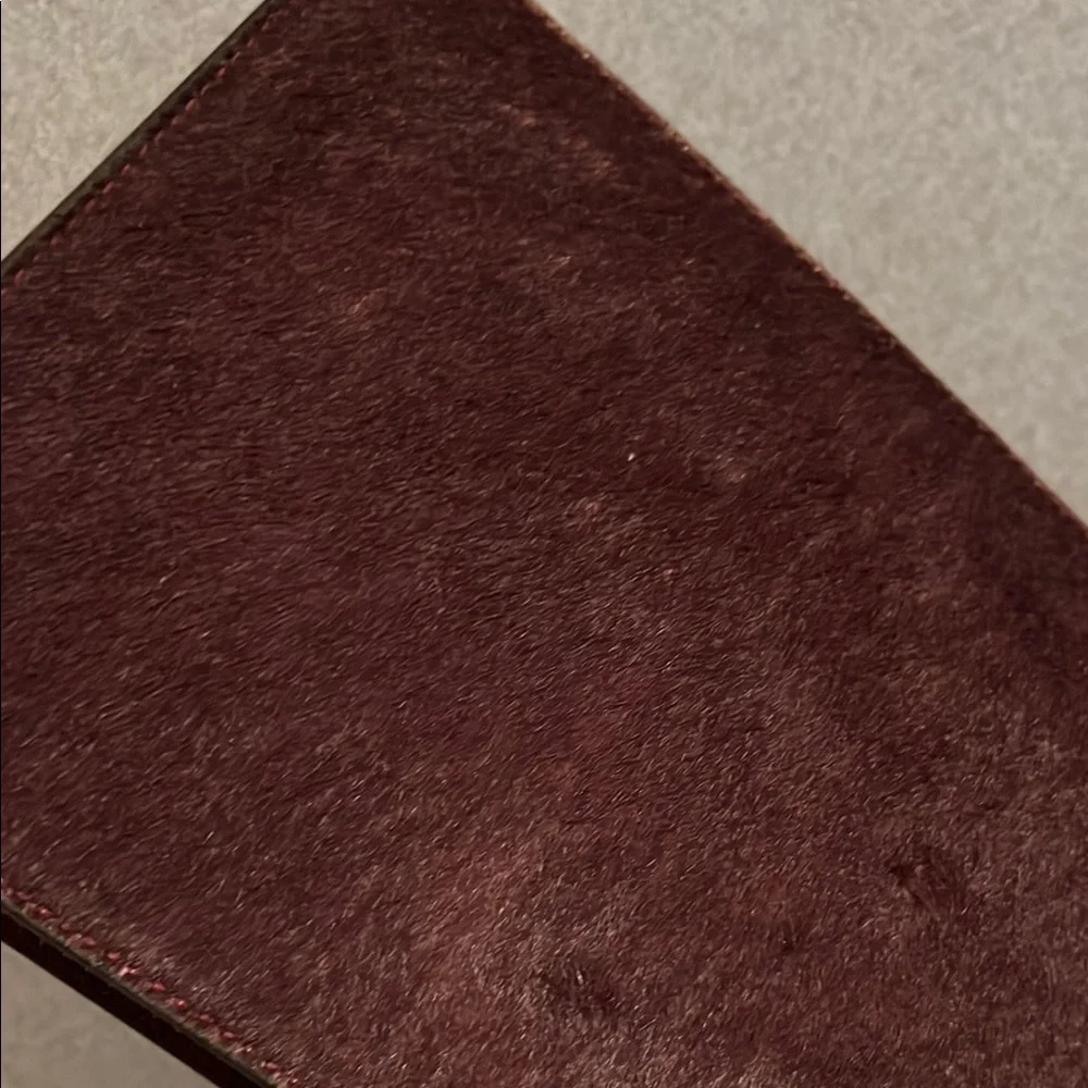 NWT kate spade burgundy suede pouch with gold logo